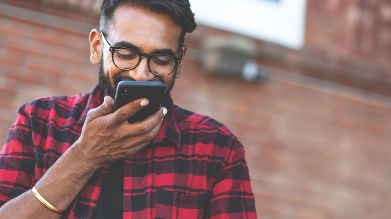 Image of man speaking into phone