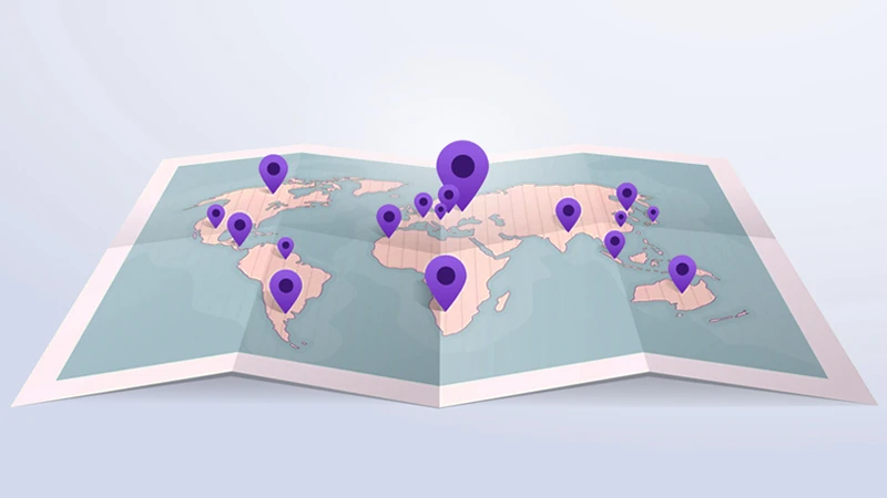 Illustration of a paper map of the world with pins in various locations