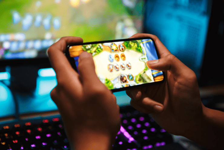 A person playing a game on his smartphone