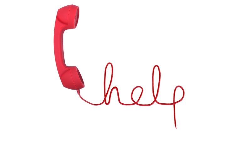 Red telephone with help text isolated on a white background