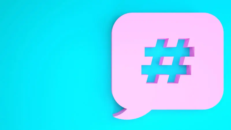 pink speech bubble with hashtag symbol on blue background