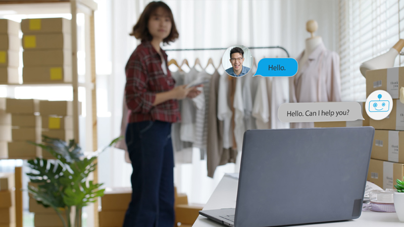 ECommerce shop employee looking at a laptop from a distance, with visual elements meant to convey a support conversation