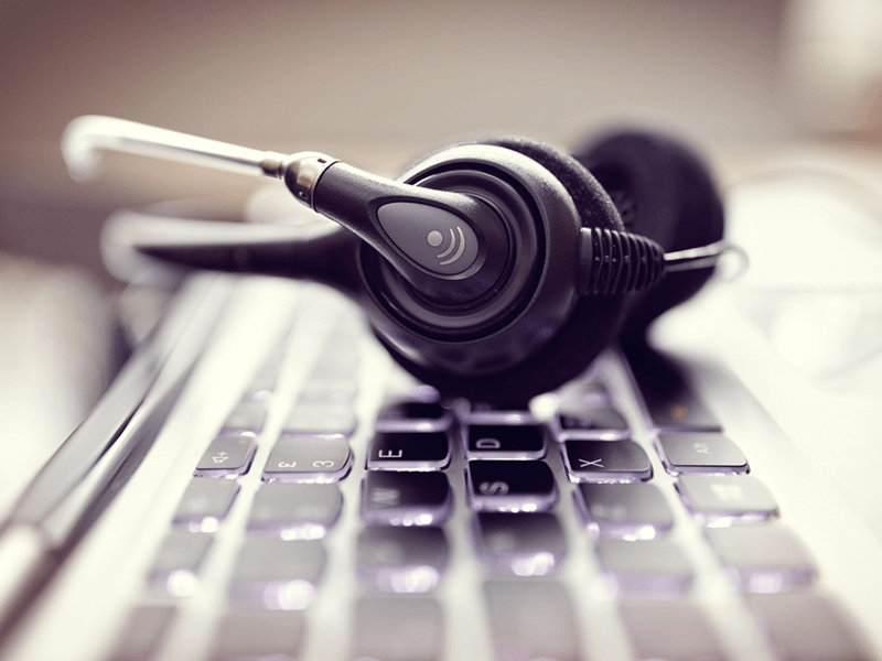 voice headset resting on a keyboard