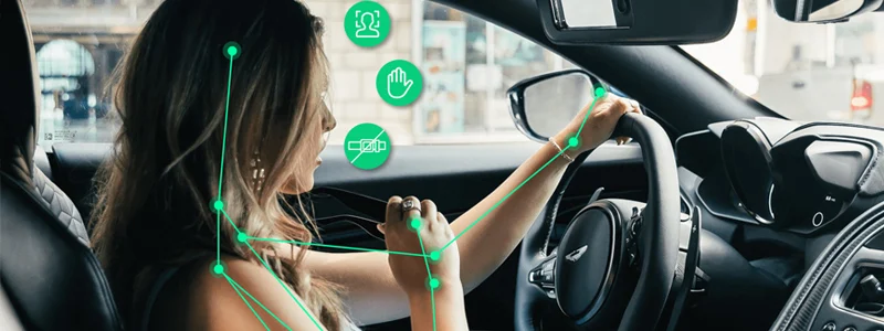 Person driving car with annotations meant to convey accurate hand and pose tracking