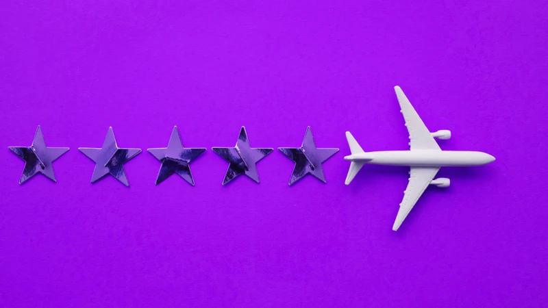 Airplane leaving a trail of five stars, meant to symbolize positive customer experiences in the travel and hospitality industry