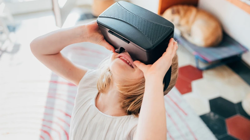 Photo of child interacting with virtual reality technology