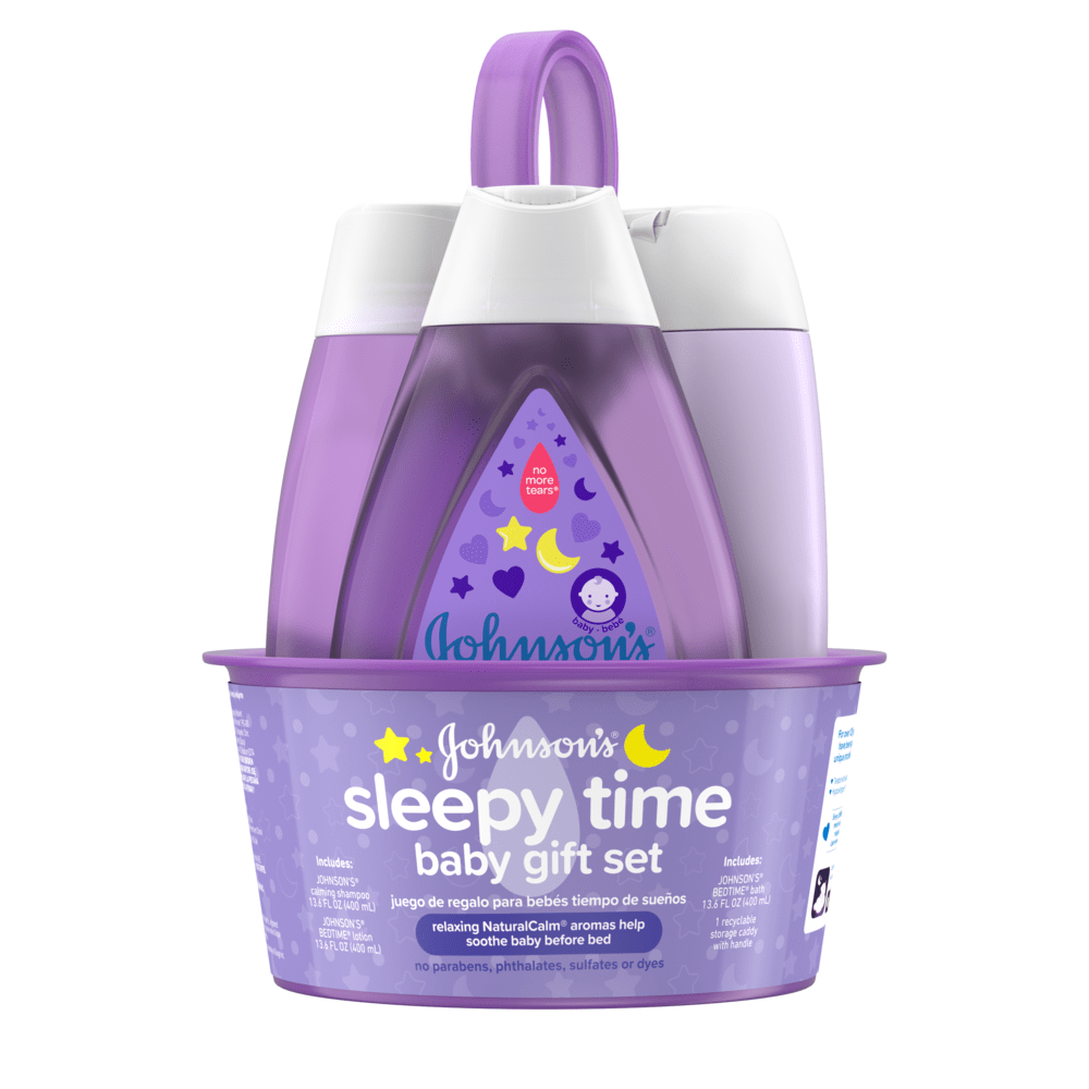 A purple gift set contains three baby care products with the text "Johnson's sleepy time baby gift set" on the front. The bottles sit in a matching tray with a carrying handle.