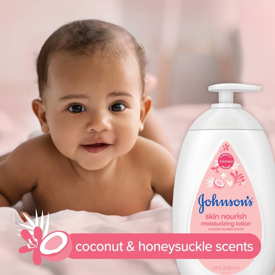 A smiling baby lies on its stomach on a bed next to a bottle of Johnson’s skin nourish moisturizing lotion. Text: "coconut & honeysuckle scents, Clinically Proven Mildness, Johnson's skin nourish moisturizing lotion, 16.9 FL OZ (500 ml)."