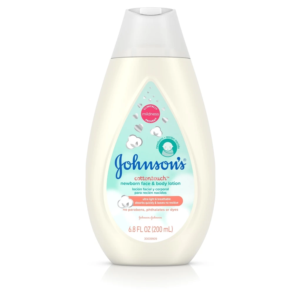 Pump bottle of Johnson's CottonTouch newborn face and body lotion, 6.8 FL OZ (200 mL), with pink and blue label and no parabens, phthalates, or dyes.