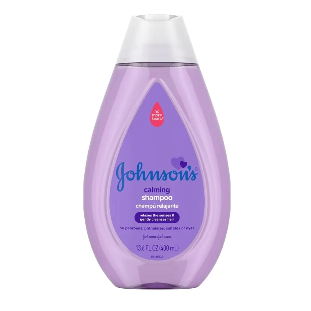 Johnson's Baby Calming Shampoo in a 13.6 FL OZ (400 mL) purple bottle, with "No More Tears" label, designed to relax and gently cleanse hair. Free of parabens, phthalates, sulfates, or dyes.