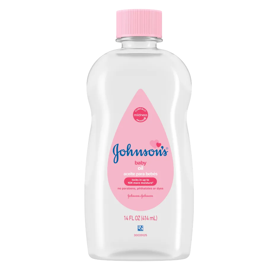 Transparent bottle of Johnson's baby oil with pink cap and label, 14 FL OZ (414 mL), featuring Spanish text and no parabens, phthalates, or dyes.