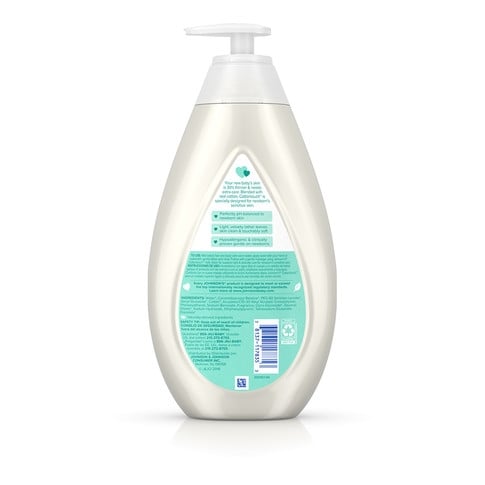 A transparent pump bottle of Johnson's CottonTouch newborn wash and shampoo with a green label, containing 100% gentle ingredients, stands against a plain, white background.