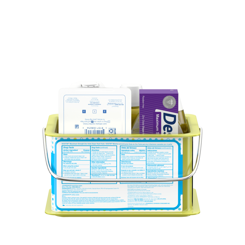 Back view of a green basket containing baby care products, prominently showing a purple box and white bottles with labels.