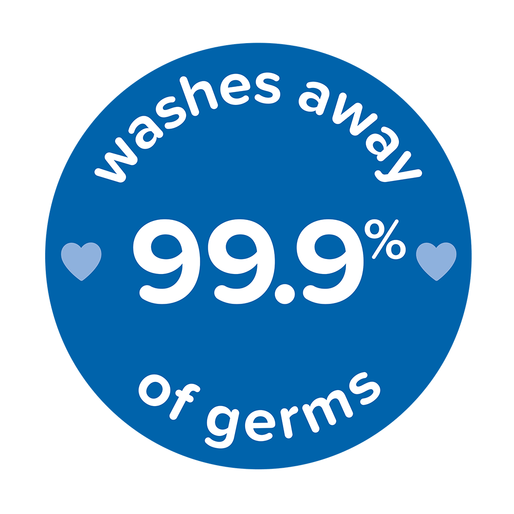 Blue circular badge with white text "washes away 99.9% of germs" and two small heart icons on either side of the text, related to Johnson's Baby products.