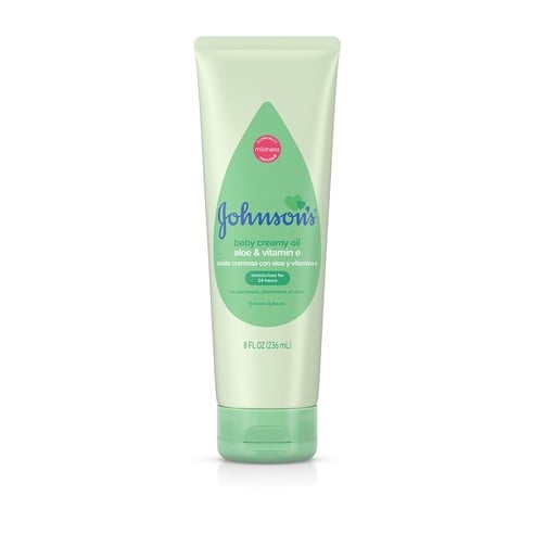 A green tube labeled "Johnson's baby creamy oil aloe & vitamin E, with aloe and vitamin E," designed for moisturizing, stands against a plain white background. The tube has a tear-drop shaped label. 8 FL OZ (236 mL).