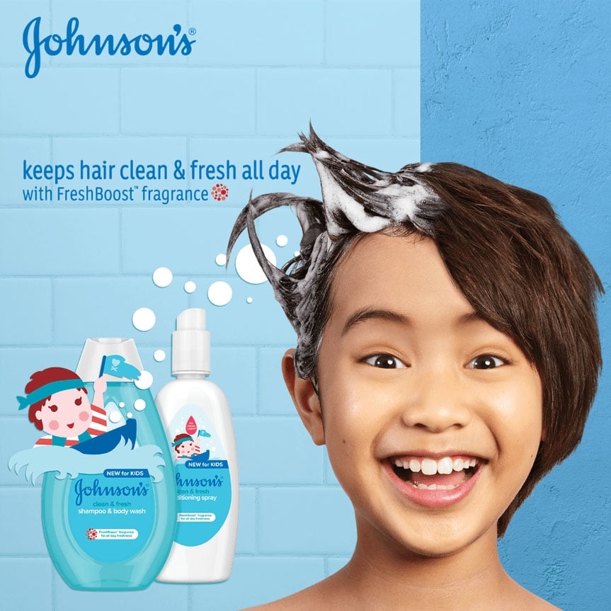 Johnson's Clean & Fresh shampoo and body wash and Johnson's Clean & Fresh conditioner bottles with a child smiling, stating it keeps hair clean and fresh all day with FreshBoost fragrance.