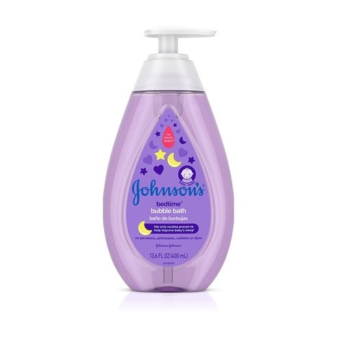 A purple bottle with a pump dispenser, containing Johnson's bedtime bubble bath in a 13.6 fl oz (400 mL) size. The label features moons and stars, with bilingual English and Spanish text.