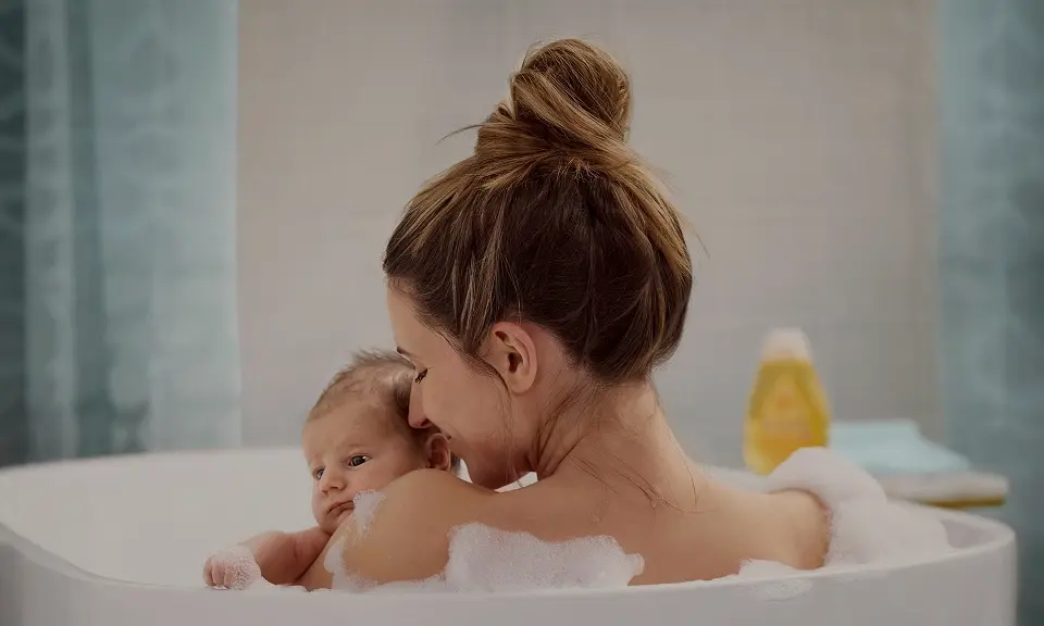 Article card Who says baby products aren’t for adults? Image of a mother and her baby on bath tube