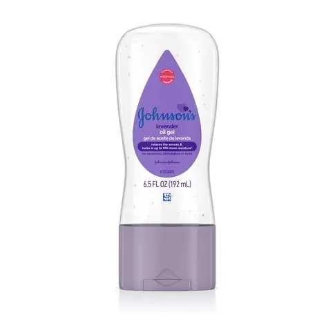 A lavender Johnson's Baby Oil Gel tube with chamomile sits upright against a white background. Text on label: "Clinically Proven Mildness," "Johnson's Baby Oil Gel," "with chamomile," and "6.5 FL OZ (192 mL)."