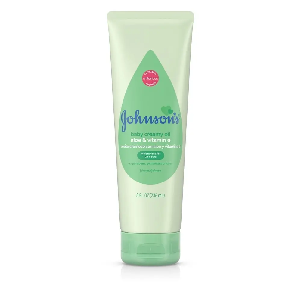 Johnsons Baby creamy oil with aloe and vitamin E, 8 fl oz (236 ml), in a green tube, labeled 'clinically mildness proven' and 'no parabens, phthalates, dyes.'