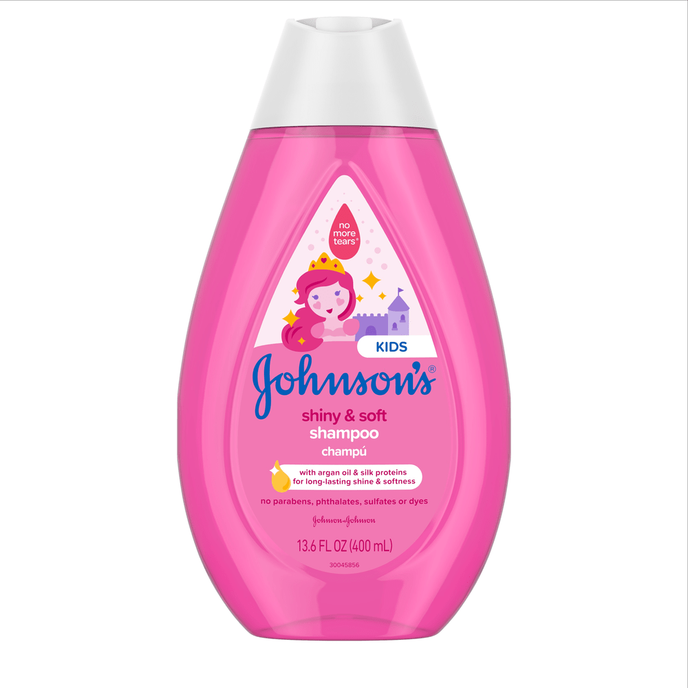 Johnson's Kids shiny & soft shampoo bottle, 13.6 FL OZ (400 mL), pink packaging with cartoon princess and castle. Contains argan oil & silk proteins for long-lasting shine and softness. Free from parabens, phthalates, sulfates, or dyes.