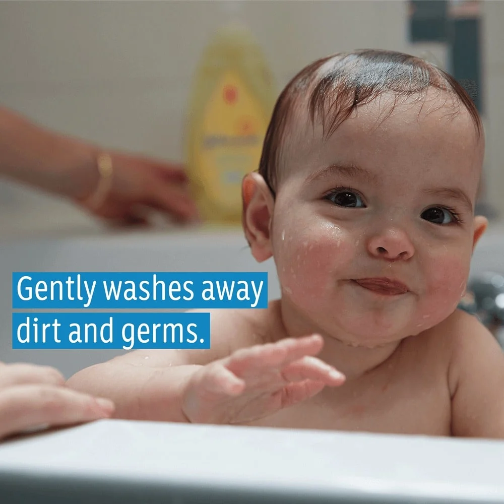 Baby in a bathtub with Johnson's Head-To-Toe® Wash and Shampoo in the background, text reads 'Gently washes away dirt and germs.