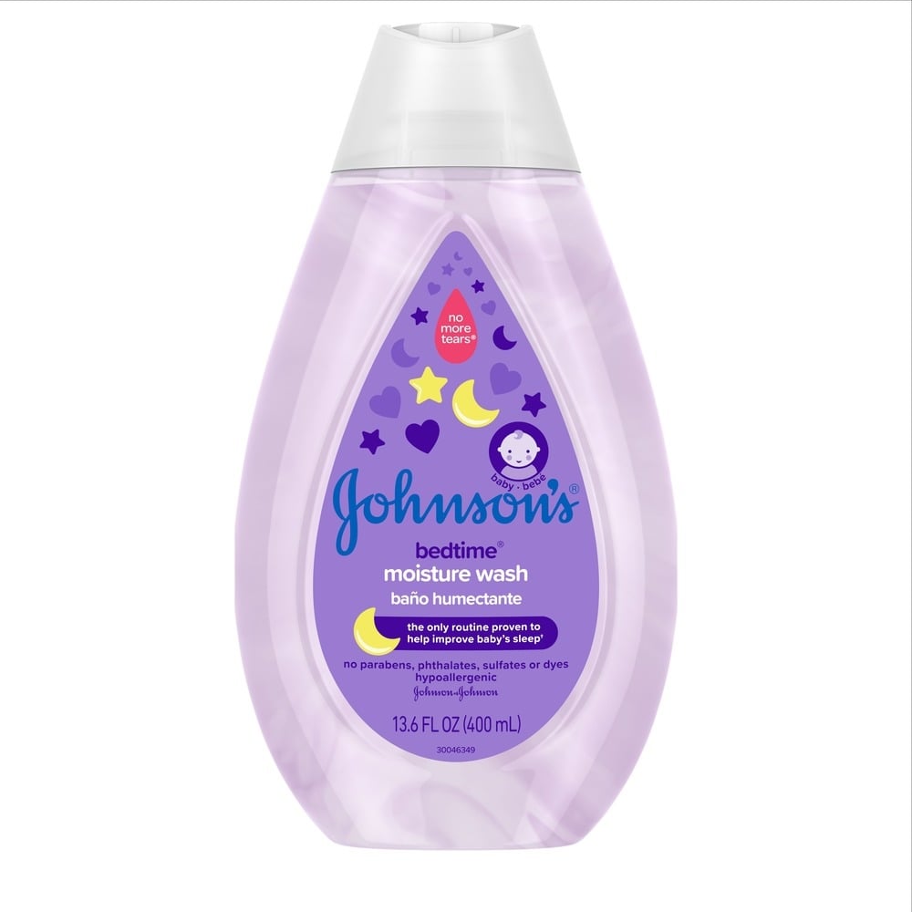 Johnson's Bedtime Moisture Wash bottle, 13.6 FL OZ (400 mL), in purple packaging with moon and star designs. Labeled for improving baby's sleep, hypoallergenic, and free of parabens, phthalates, sulfates, and dyes.