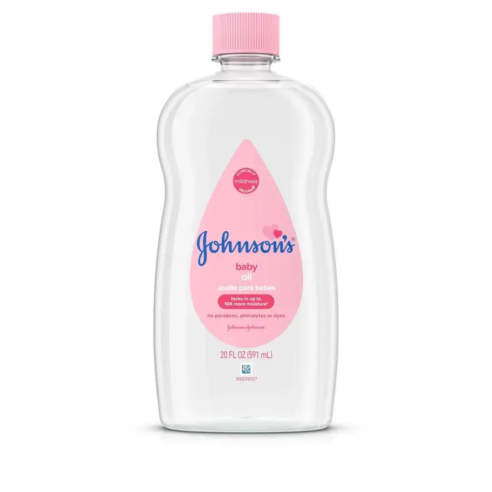 Johnson's Baby Oil bottle with pink cap, 20 FL OZ (591 mL), labeled as mildness tested, locks in up to 10 times more moisture, and free of parabens, phthalates, or dyes.