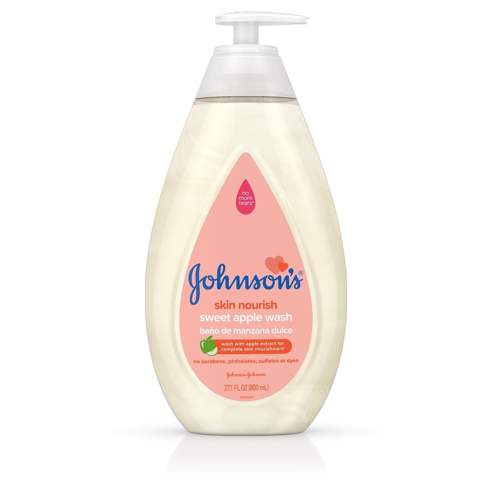 Jabón líquido de manzana dulce Johnsons Baby Skin Nourish, envase con dosificador de 27.1 fl oz, sin parabenos, ftalatos, sulfatos ni colorantes, ilustrado con una pequeña manzana verde y roja.