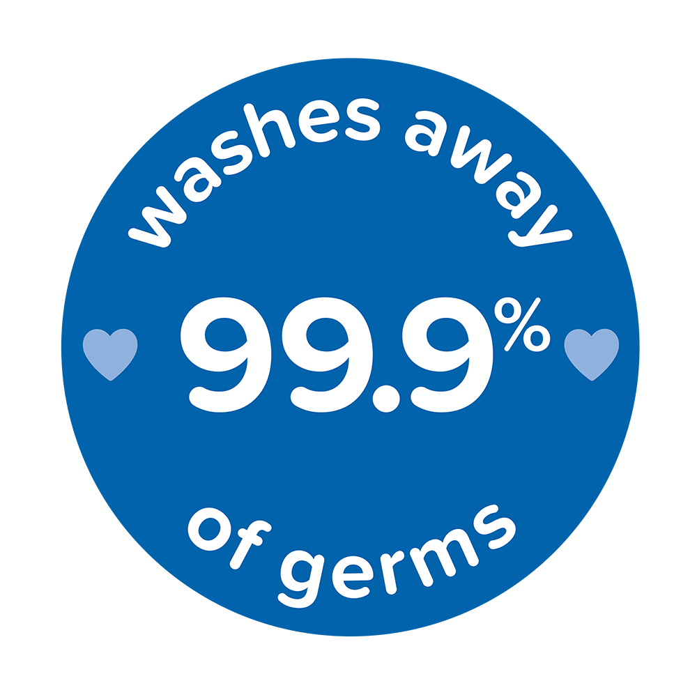Blue circular badge with white text "washes away 99.9% of germs" and two small heart icons on either side of the text, related to Johnson's Baby products.