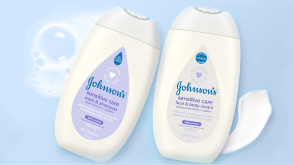 Two bottles of Johnsons sensitive care products on a light blue background with bubbles. One bottle is wash & shampoo, and the other is face & body cream, both 16.9 fl oz (500 ml) with a white cap and purple labeling.