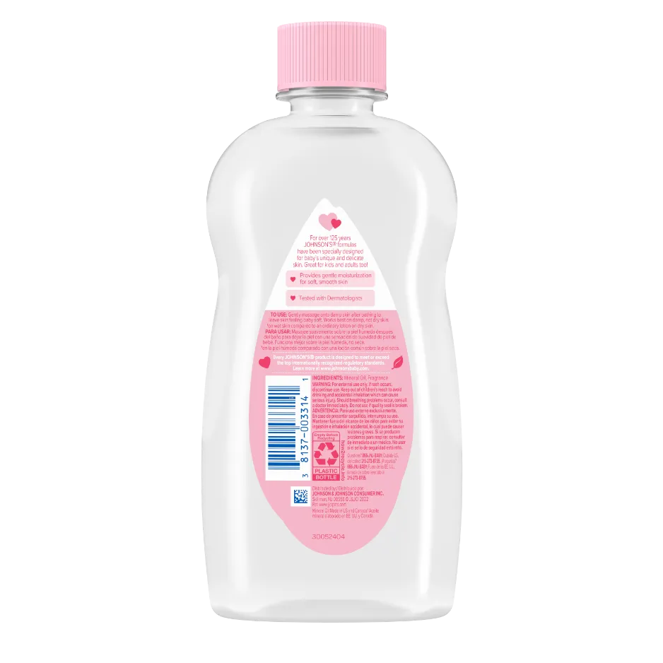 A transparent plastic bottle with a pink cap contains baby oil, and has a pink label with white and blue text, reading "JOHNSON'S baby oil.” It is placed against a white background.