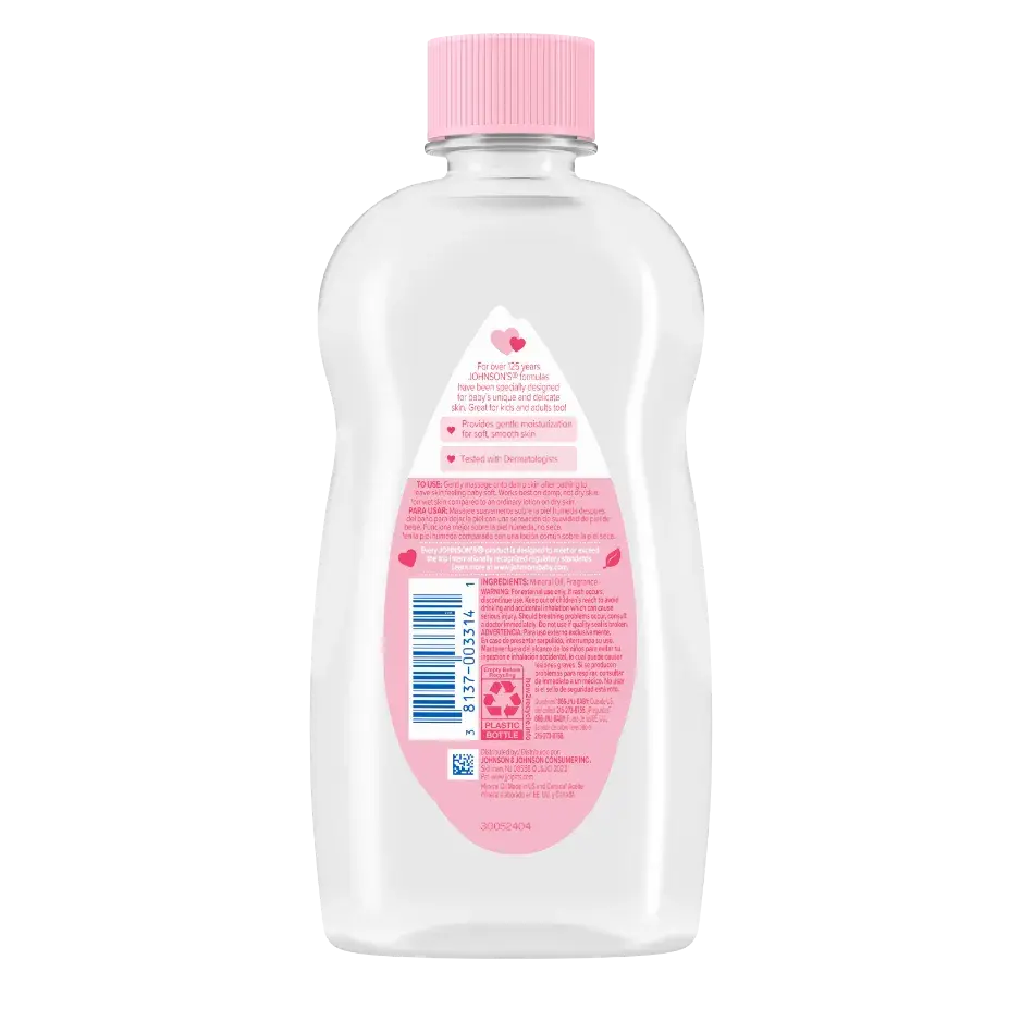 A transparent plastic bottle with a pink cap contains baby oil, and has a pink label with white and blue text, reading "JOHNSON'S baby oil.” It is placed against a white background.
