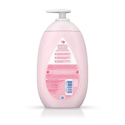 A pink bottle with a pump dispenser contains "Aveeno Baby Daily Moisture Lotion." It features protective pink labels with product details, including "Fragrance-Free," and is designed for infant skin care.
