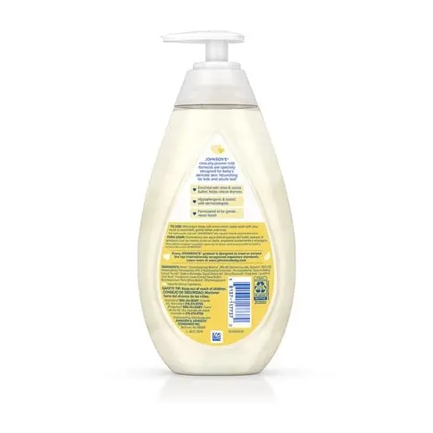 A semi-transparent bottle with a pump dispenser contains liquid. It is labeled “Johnson's CottonTouch Newborn Wash & Shampoo” with product details in English and Spanish on the back against a white background.