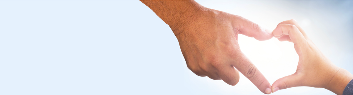 Parent hand and child's hand forming a heart shape against a light blue background, symbolizing care and sustainability.