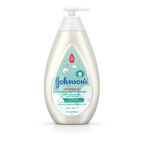 A bottle of Johnson's CottonTouch newborn wash and shampoo with a pump dispenser, 27.1 fl oz (800 ml), featuring a cotton illustration within an off-white and turquoise label.