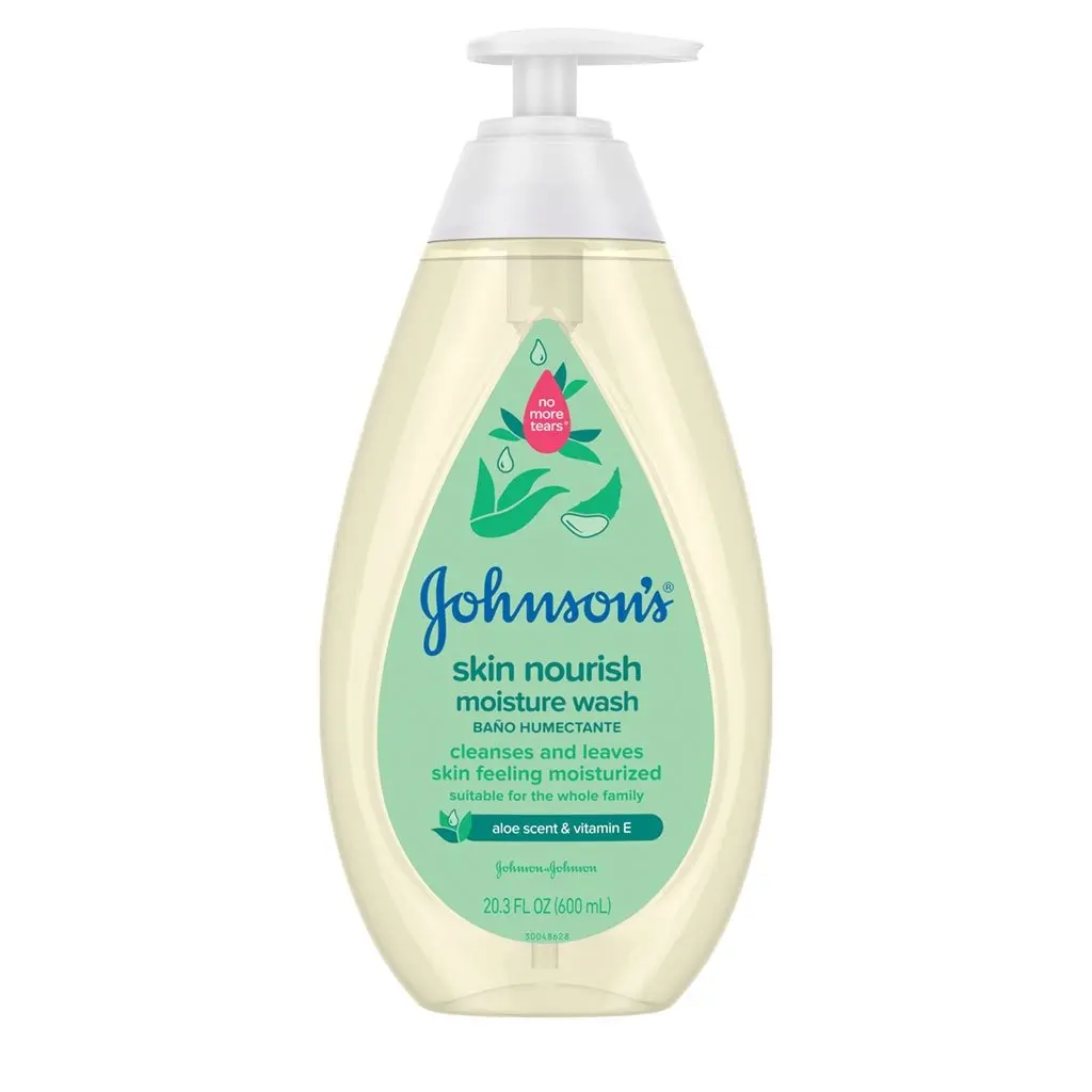 A clear plastic bottle labeled "Johnson's Skin Nourish Moisture Wash," featuring a pink flower graphic and pump dispenser, stands against a white background. The label text highlights shea and cocoa butter ingredients.