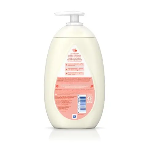 A white pump bottle of Aveeno Baby Daily Moisture Lotion. The bottle features a pink label with product information and is set against a plain white background.