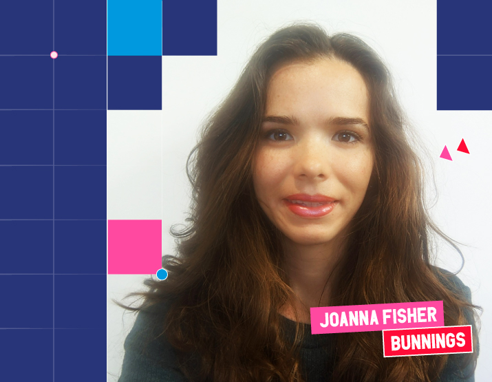 A photograph of Joanna Fisher, a woman with long brunette hair wearing a black sweater. She is smiling and looking direct to camera. Square Graphic elements border the image, and across the bottom right of the image, her name is included in block letters against a pink background. Underneath her name, BUNNINGS is written in white block letters against a red background.