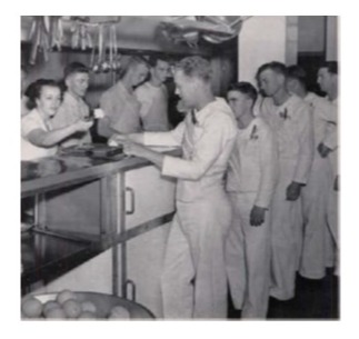 Mess time and sailors pass through the Sweet-Chrisman kitchen to get their rations.