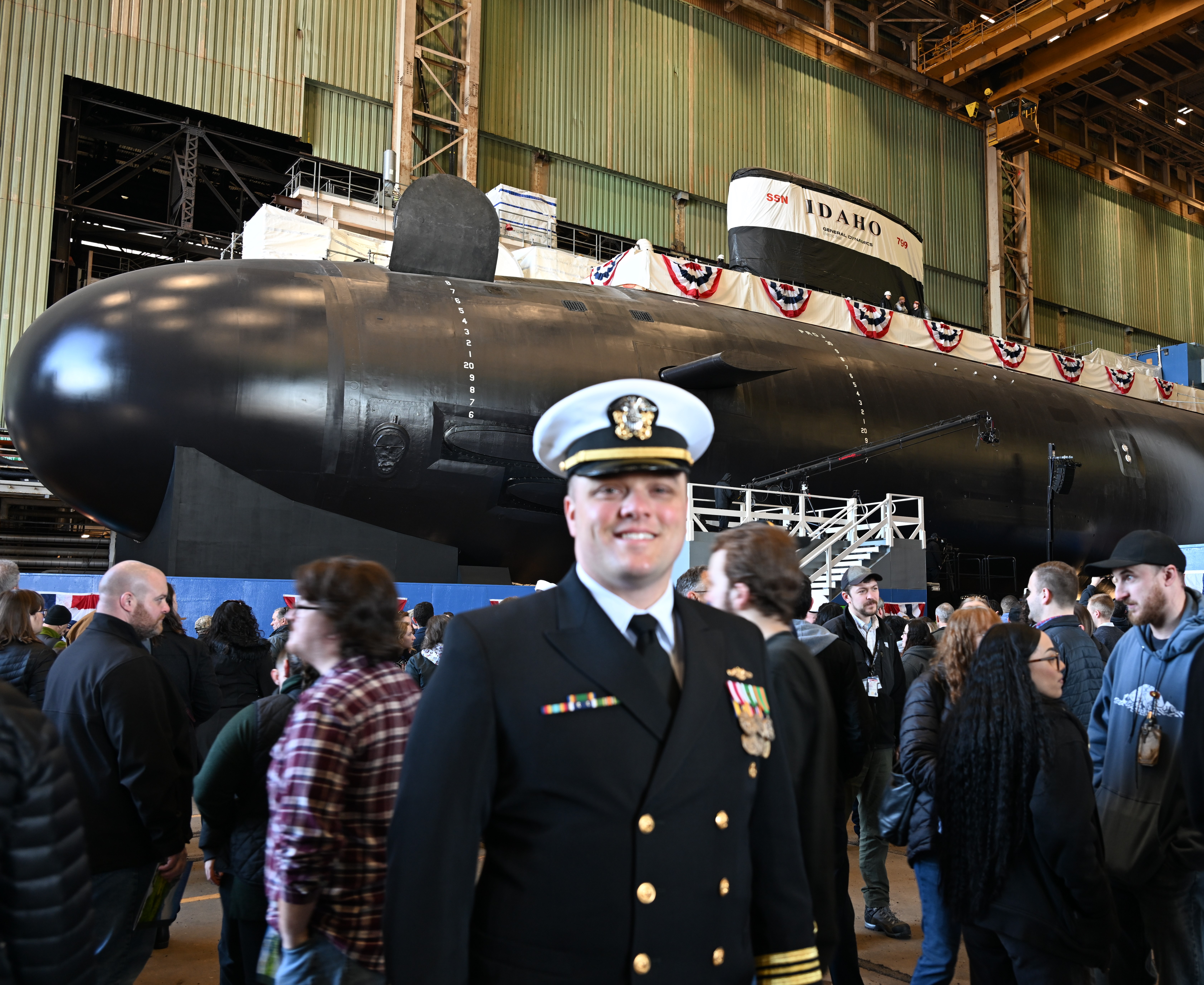 PCU IDAHO Executive Officer LCDR Justin Devillar smiles in front of his boat. Photo by Laura Barton. 