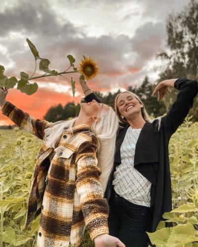 Two women on a field of flowers