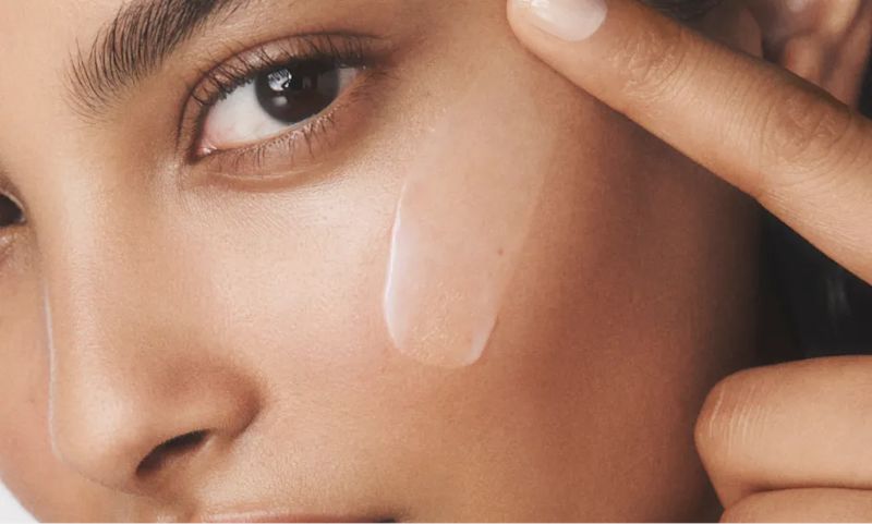 Woman with healthy skin applying Neutrogena® Hydro Boost Water Gel