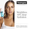 Tate McRae holding a bottle of Hydro Boost Hyaluronic Acid Moisturizer. Weightless SPF, deep hydration