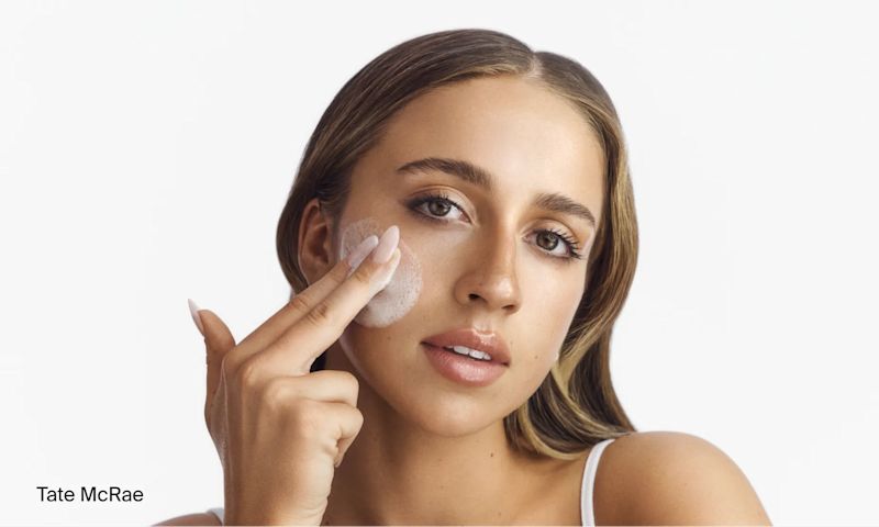 Tate McRae applying Neutrogena® double cleansing duo to face