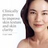 Smiling woman with clear skin, Neutrogena® clinically proven to improve texture and clarity in one week