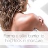 Back and shoulder of women applying Neutrogena® Body Oil Light Sesame Formula. Text reads "Forms a silky barrier to help lock in moisture".