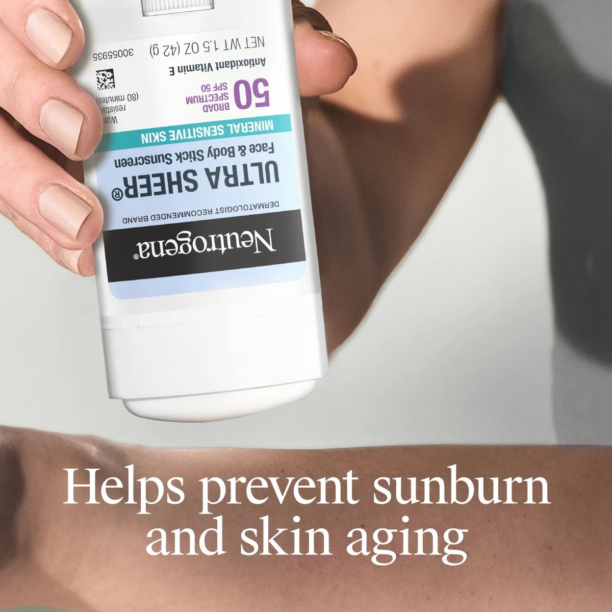 241129_441NTG_US_Mineral Stick_ML-05_Benefit.webp Hand applying Neutrogena® Ultra Sheer® stick to arm with sunburn and skin aging prevention