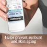 241129_441NTG_US_Mineral Stick_ML-05_Benefit.webp Hand applying Neutrogena® Ultra Sheer® stick to arm with sunburn and skin aging prevention